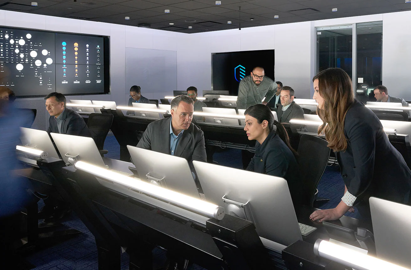 businesspeople working at an IBM Security X-Force center