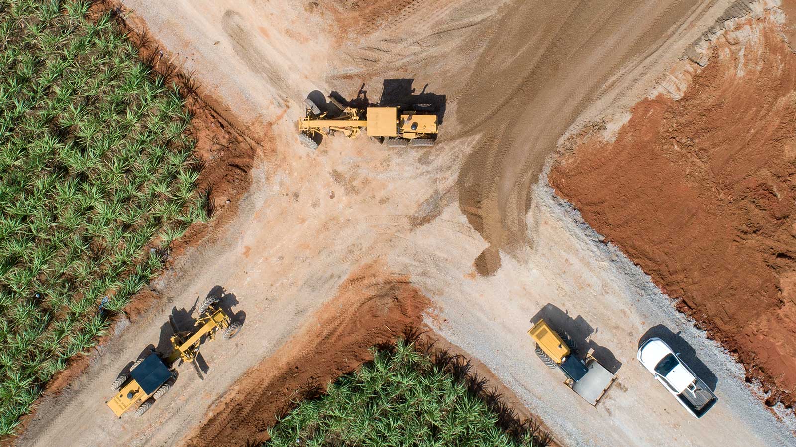 Aerial view of road construction site machines