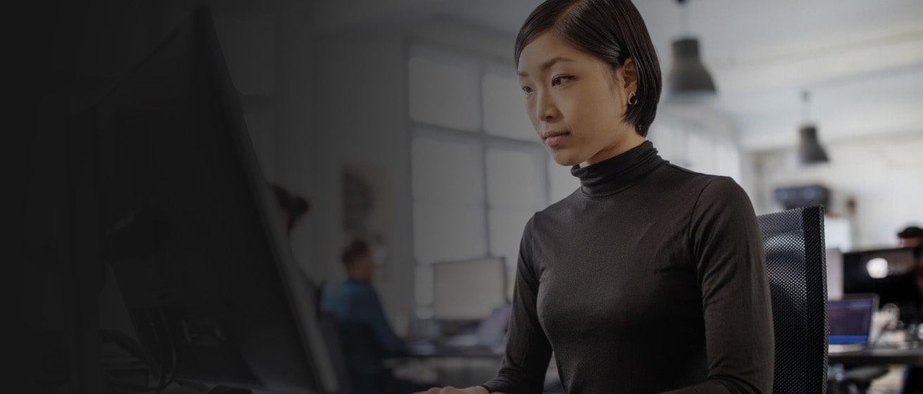 Close up of a person looking at a computer monitor