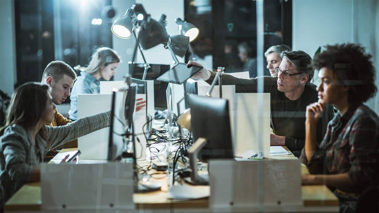 A group of people working on computers