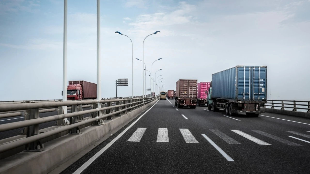 Multiple trucks on highway bridge