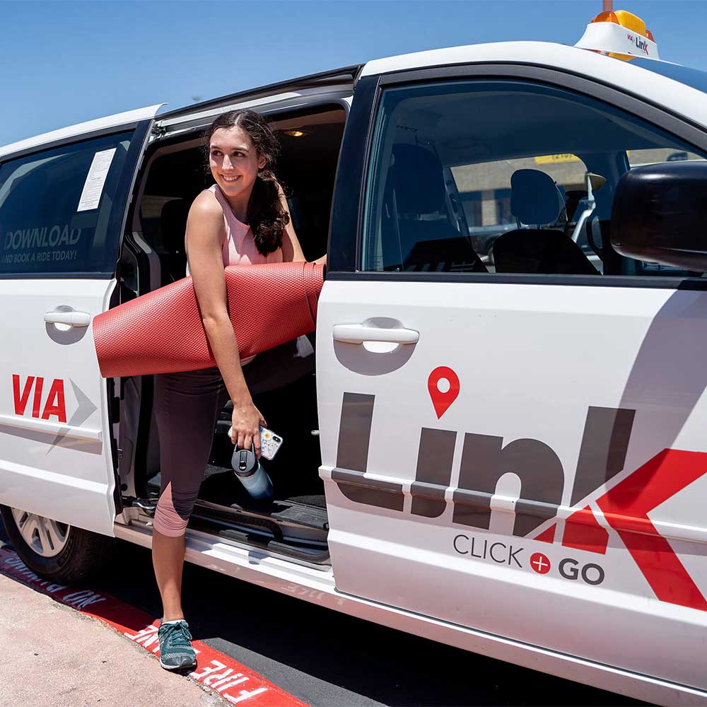 VIALink rider carrying a yoga mat