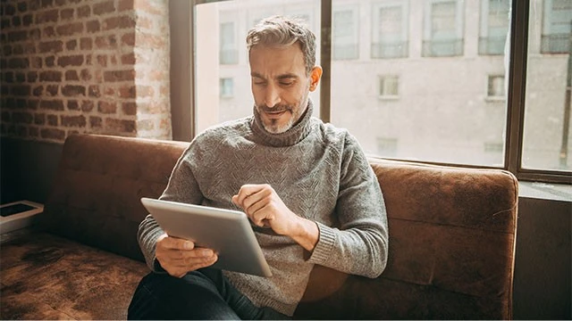 Man using digital tablet