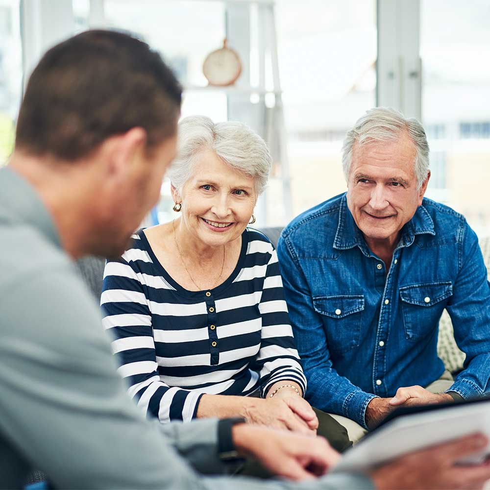 Older couple meeting with financial advisor