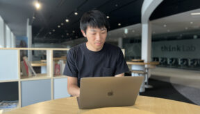 man working on laptop in IBM office in Japan