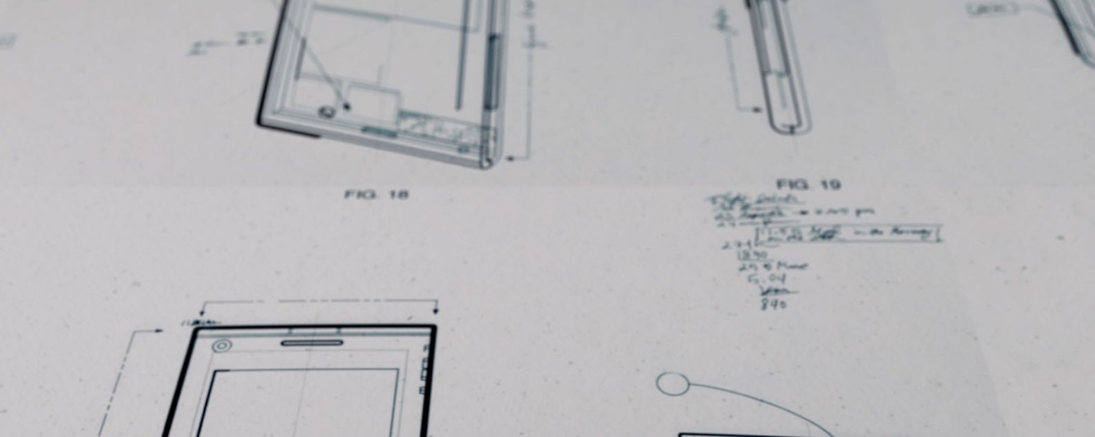Drafting paper with drawings of mechanical schematics