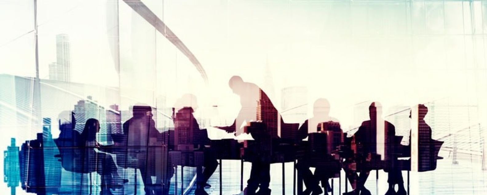 Abstract of silhouettes of business people in a meeting