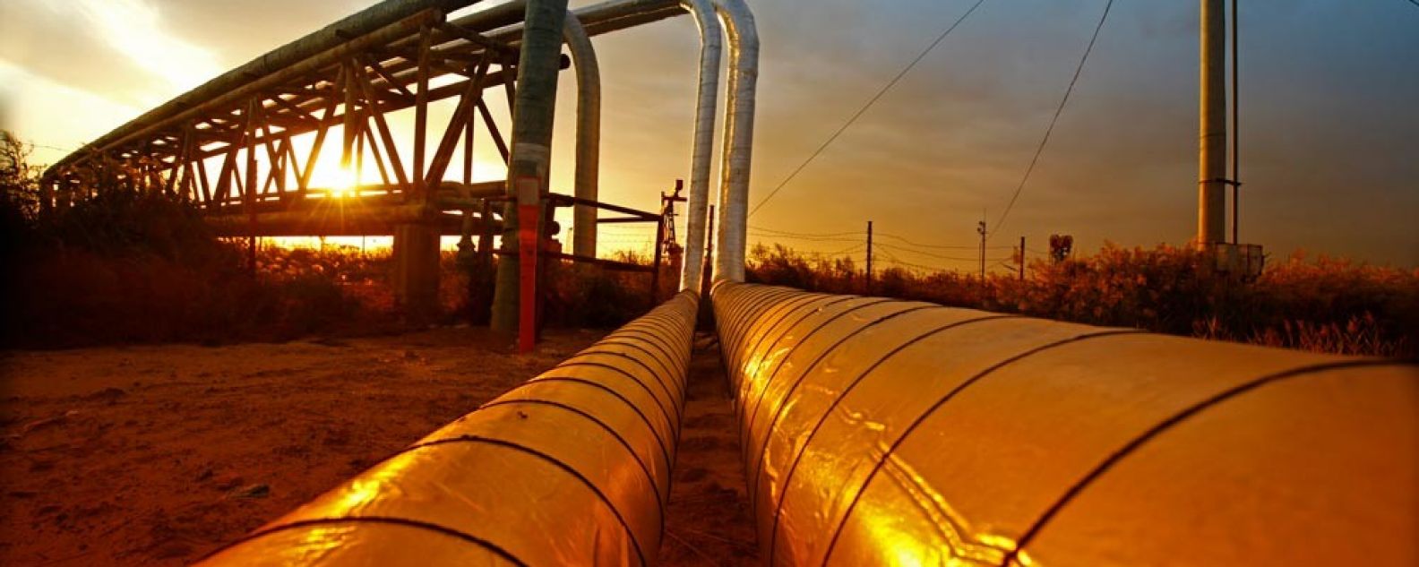 Natural gas pipeline transmission at sunset turning everything to orange