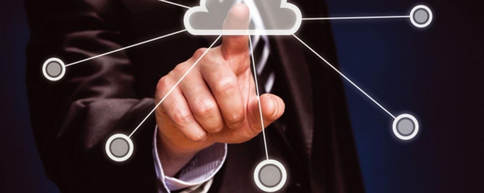 Closeup of finger pointing to a diagram of a central cloud in a cloud computing environment