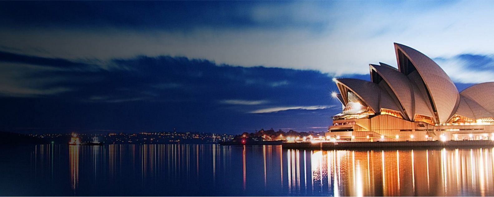 View of Sydney Opera house, all lit up at night