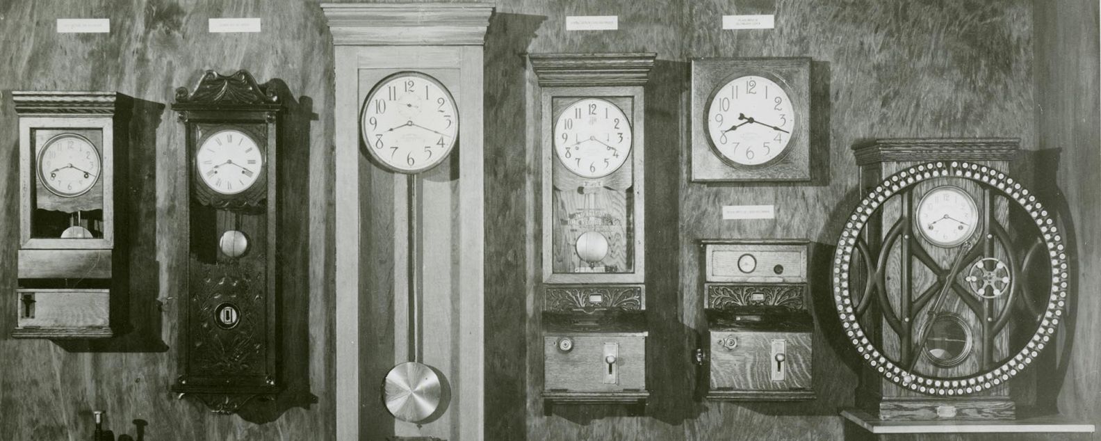 Display of 8 ITR timeclock machines, captioned "1914 time recording products"