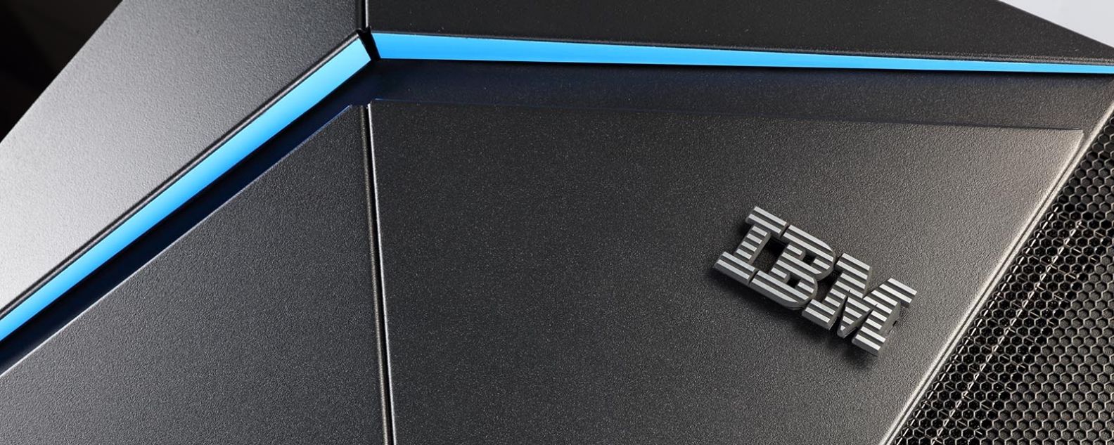 Close-up of the upper right side of the IBM System z mainframe, showing a blue horizontal stripe above the IBM logo.