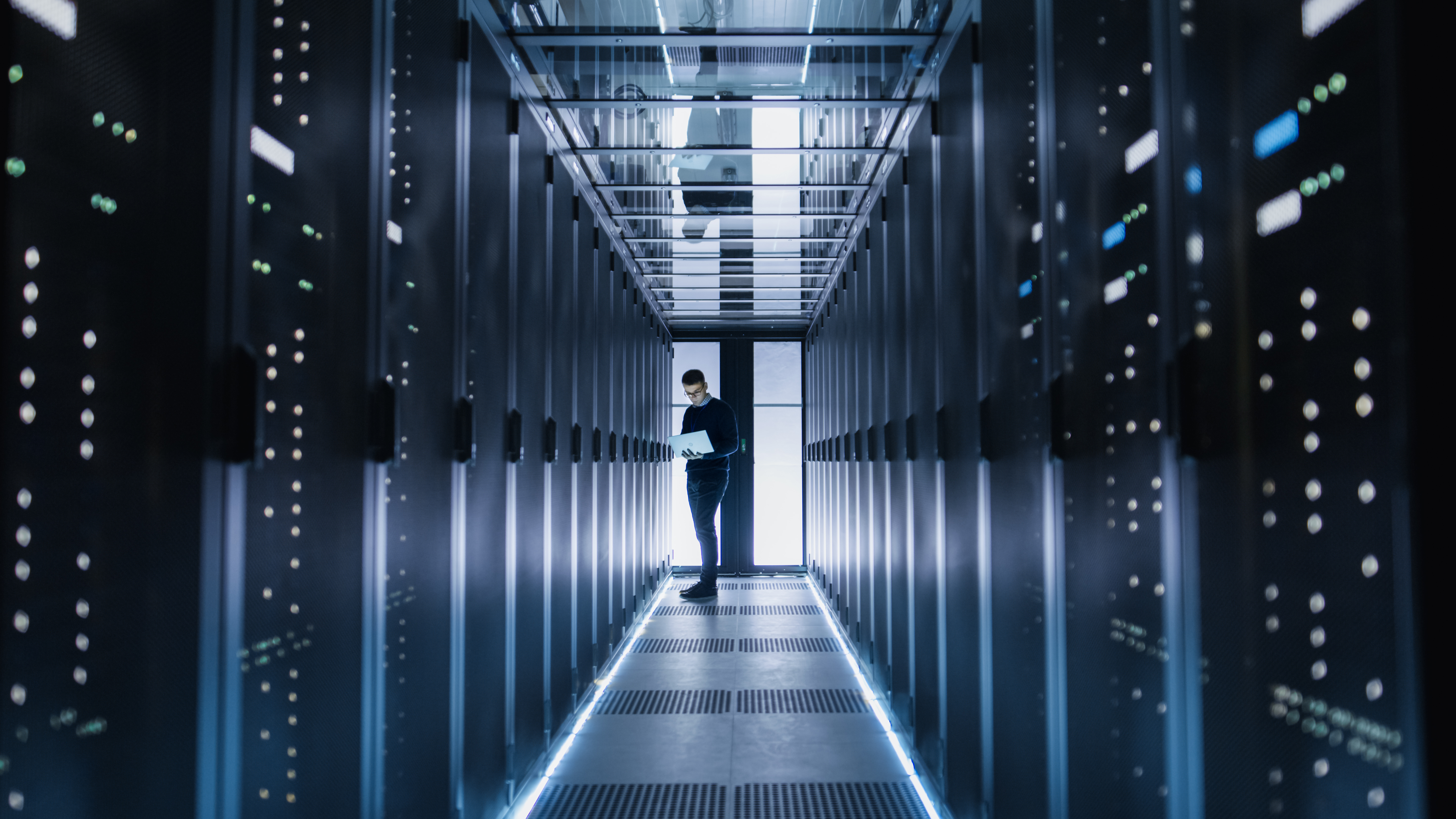 a man in a big data server room