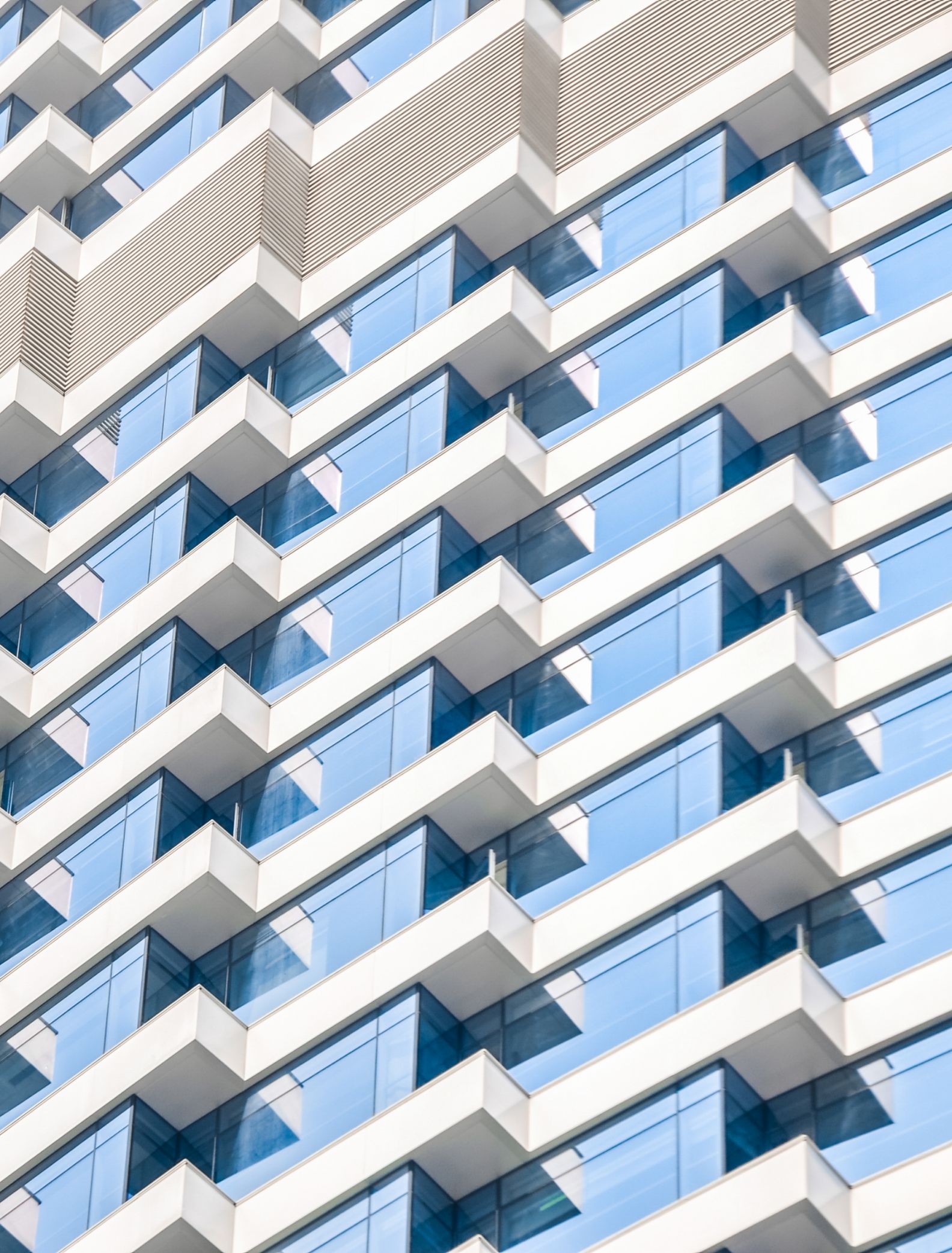 Corner of building showing multiple levels with concentric angles, creating a pattern effect