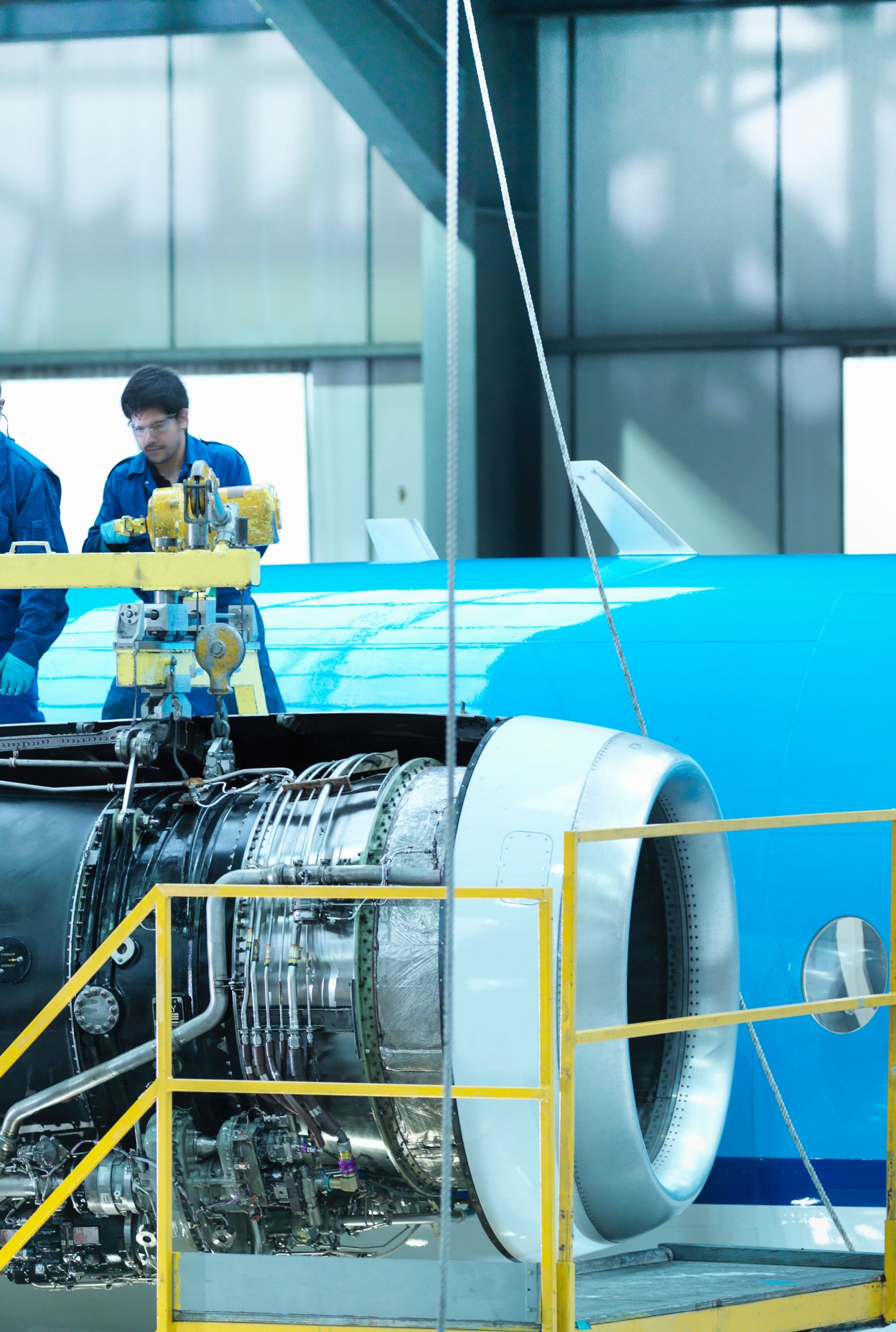 Workers examining an engine