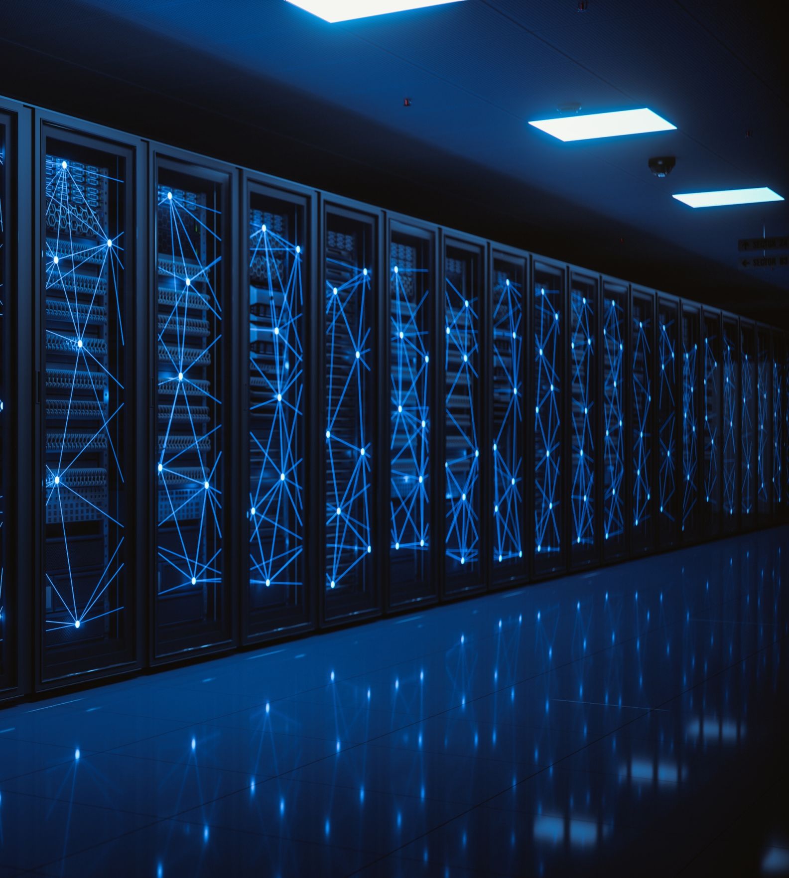 An endless row of sleek, black, floor-to ceiling servers with a web of bright blue light connecting them together