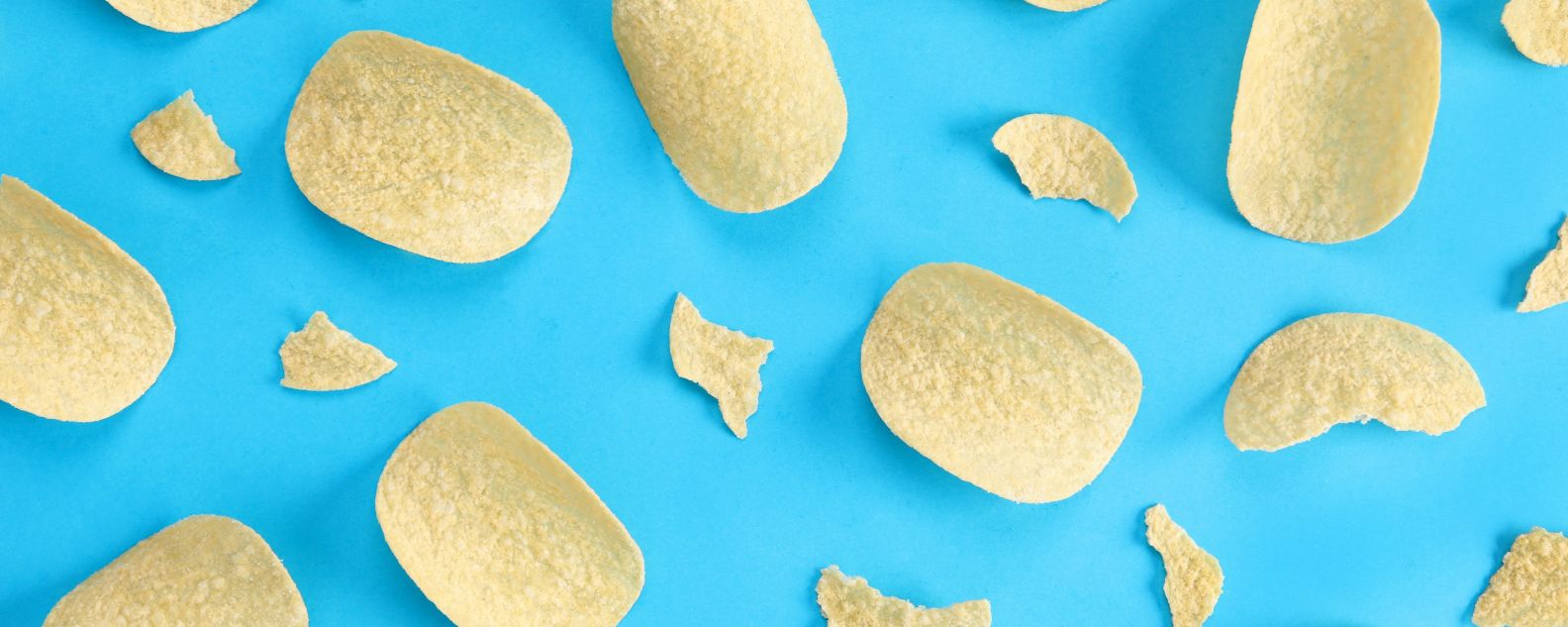 Pattern potato chips on blue background
