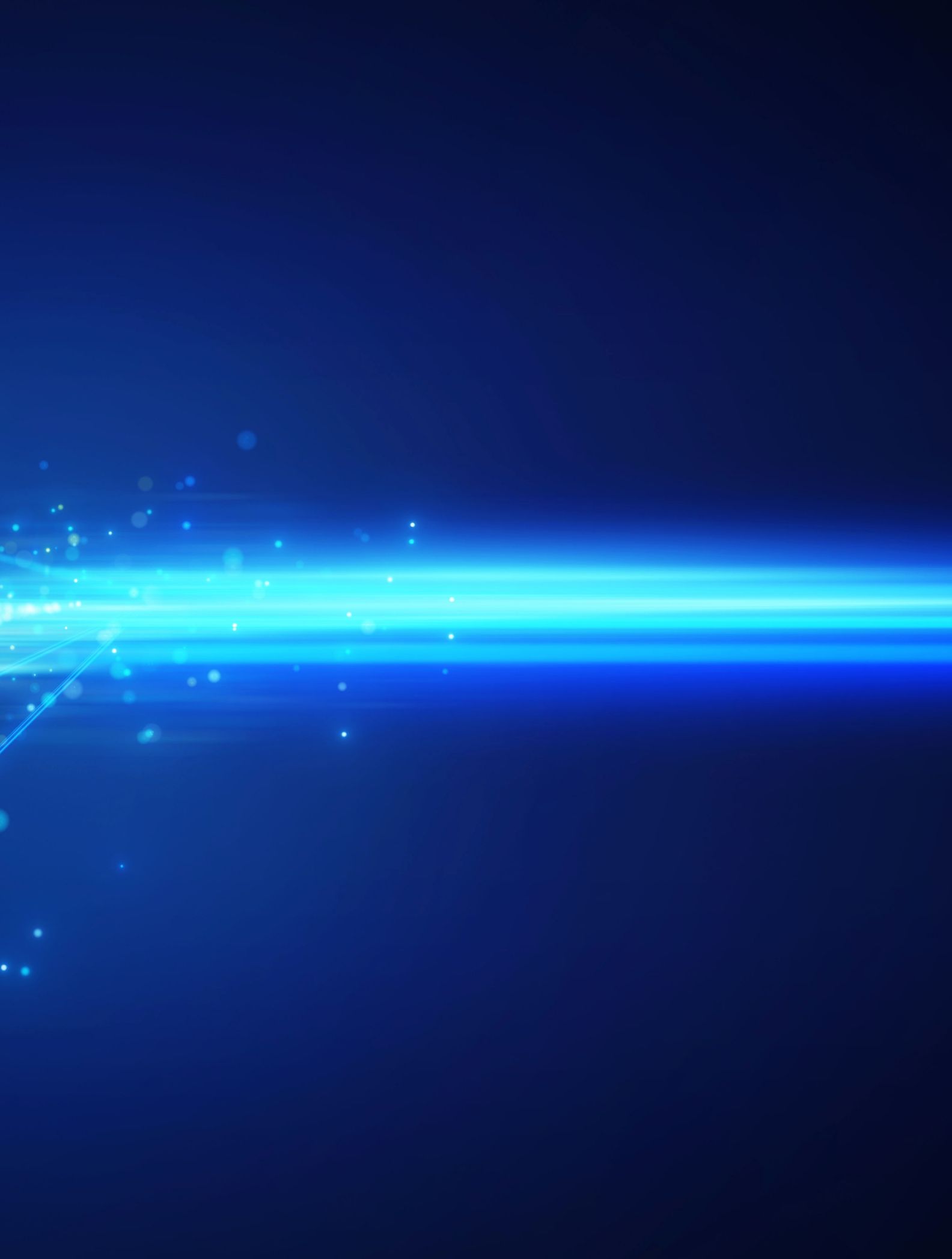 Light beam of particles against a blue background