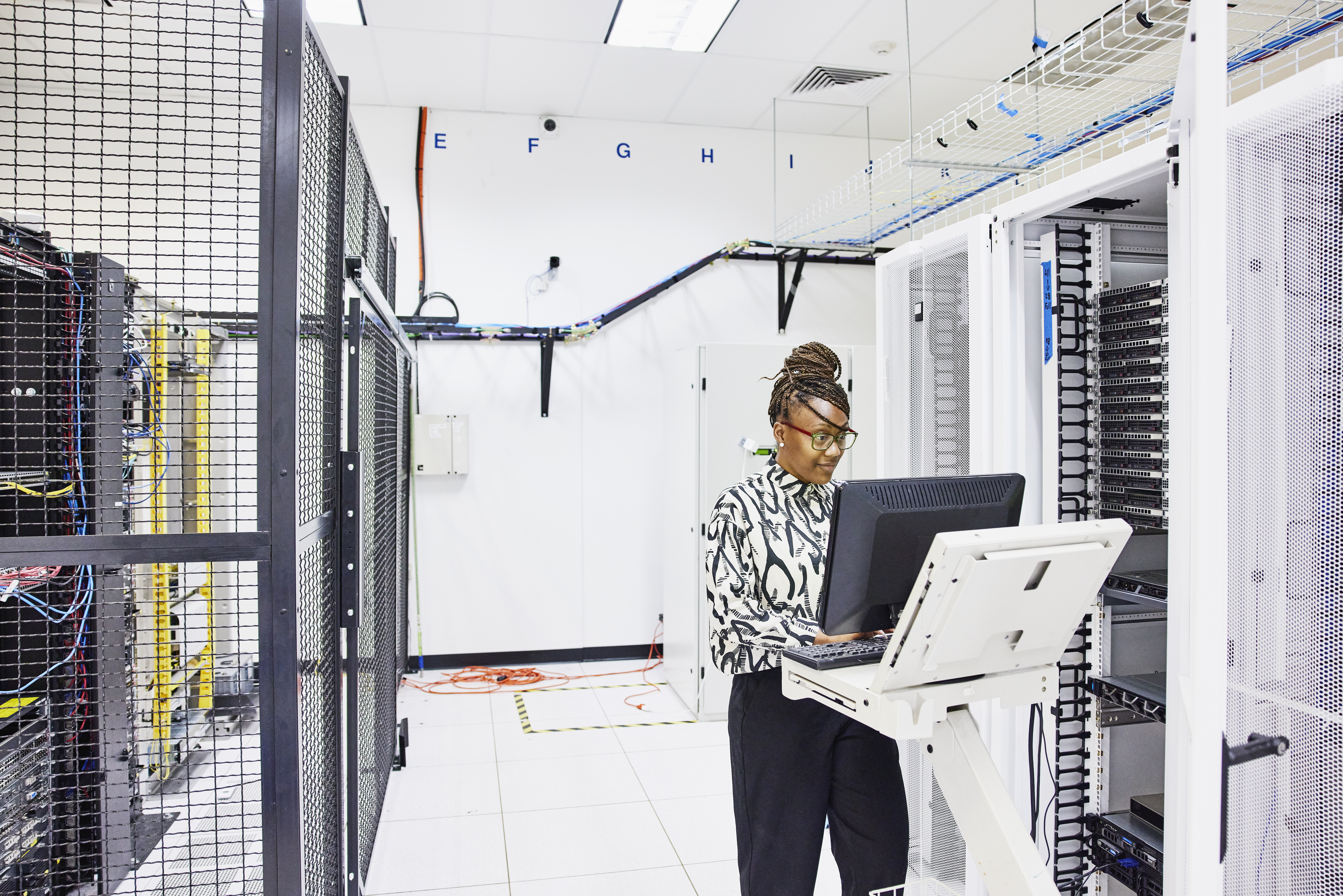  IT professional configuring server in data center