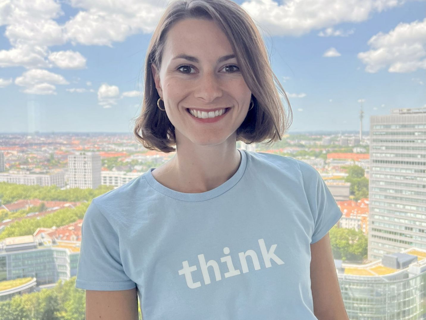 IBMer in an IBM t-shirt, smiling to the camera