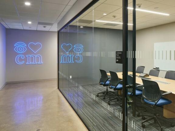 polished concrete walkway outside carpeted conference room