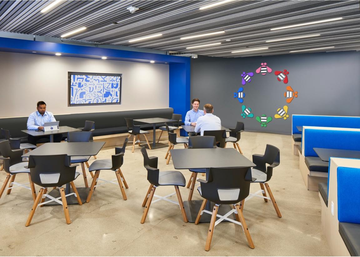 Community zone room with tables, chairs and booth seating Community zone room with tables, chairs and booth seating
