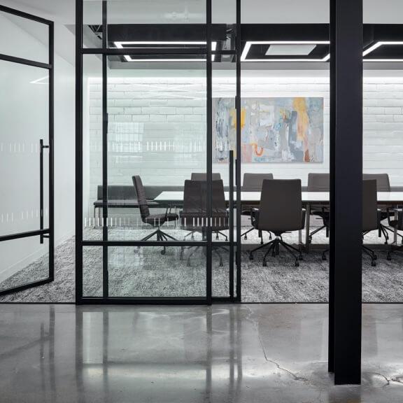 polished concrete floor outside of carpeted meeting room polished concrete floor outside of carpeted meeting room