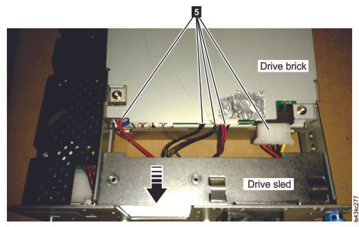 The drive brick, showing the cables to be unplugged
